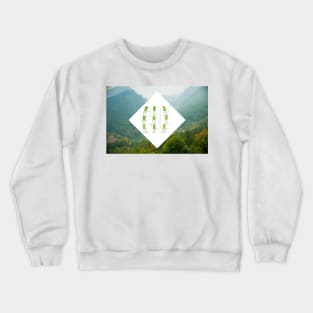 Mountain view and word Adventure made with tattoo font Crewneck Sweatshirt